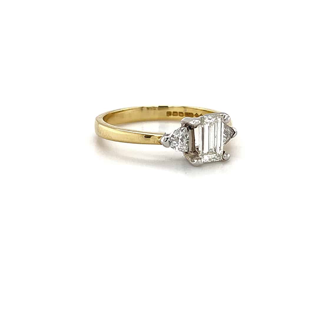 0.60ct, Emerald Cut Diamond with Trilliant Cut Shoulders in 18ct Gold