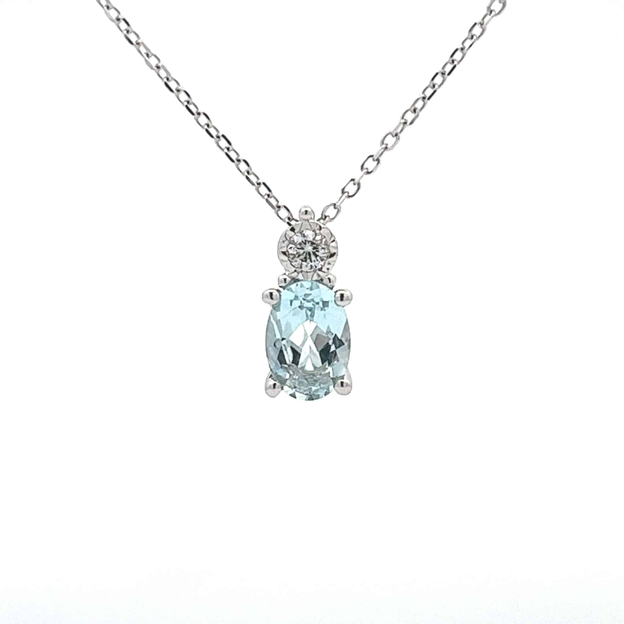 9ct White Gold Oval Blue Topaz and Diamond Pendant with 16 and 18 Inch Chain