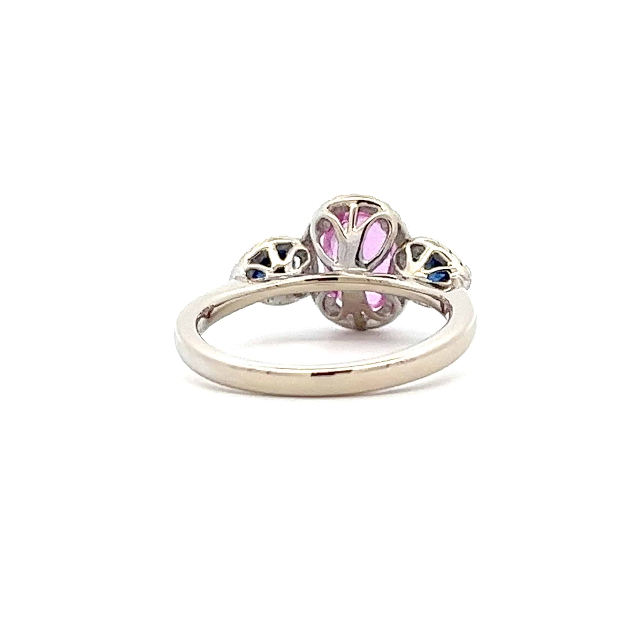 1.40ct Oval Pink Sapphire, 0.63ct Brilliant Cut Diamond Ring with Pear Shaped Blue Sapphires – 18ct White Gold